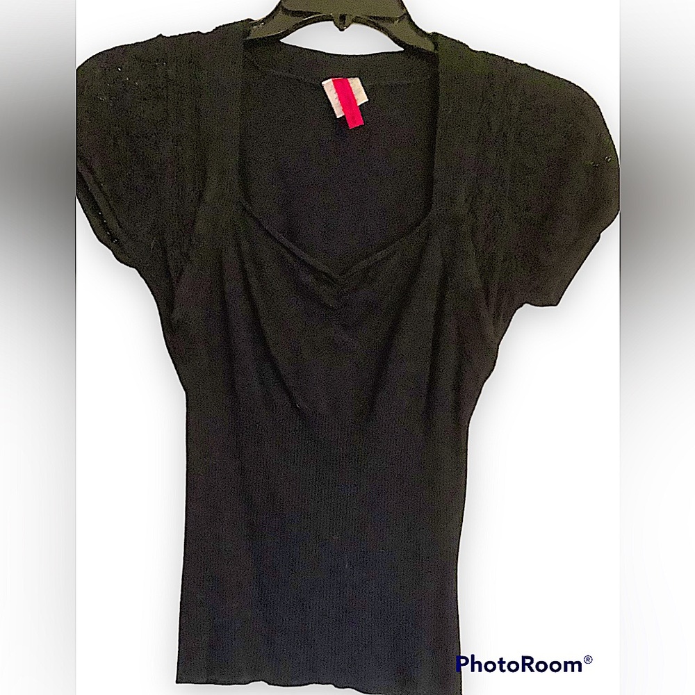 A Junior fashion sweater in pre owned condition.